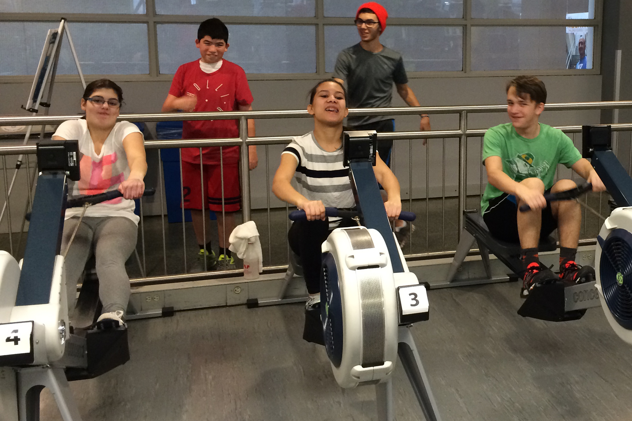 YMCA Academy students using rowing machines